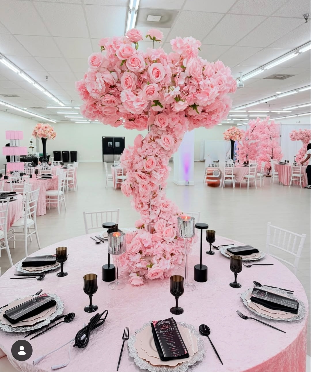 Celebration Hall decorated with an elegant pink floral centerpiece